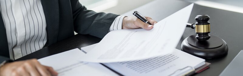 Sitting-at-desk-reading-legal-documents