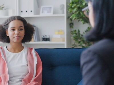 Teenager talking to female counselor