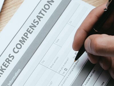 Man filling out a worker's compensation form