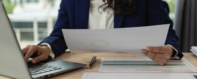 Financial analyst looking over data and financial records