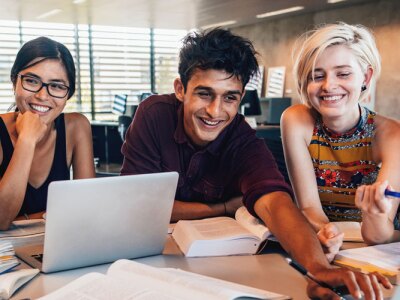 University students in cooperation with their online learning assignment.