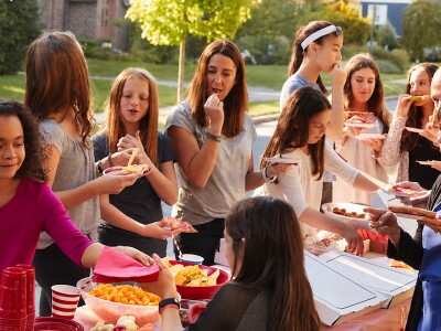 Neighbors helping themselves to food at a block party