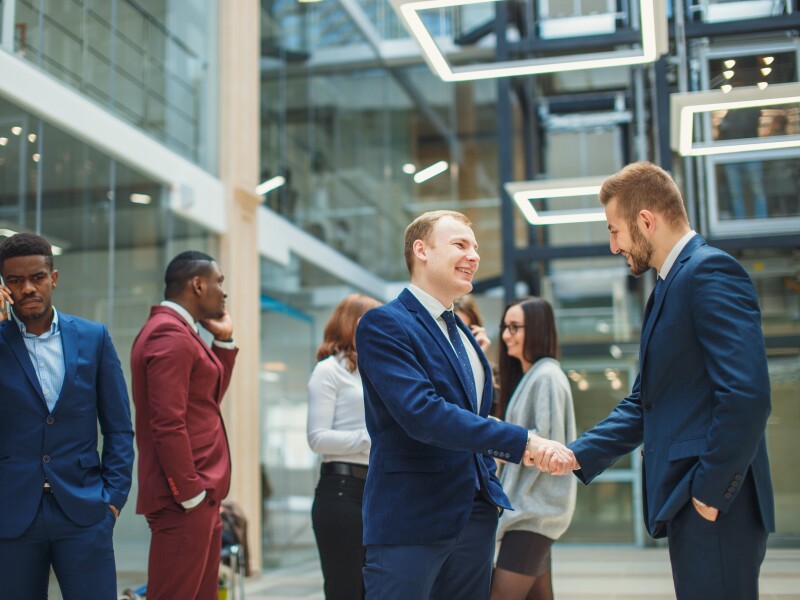 Business people shaking hands in the office after the contract is signed