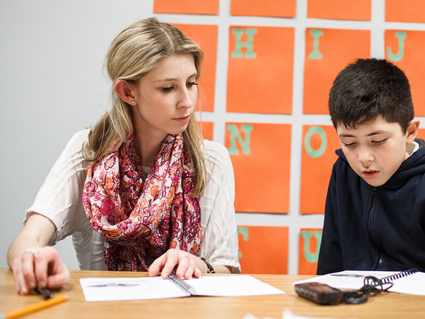 Counselor and child working together in a school