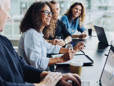 Public health professionals meeting in light-filled office