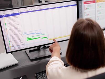 Two colleagues viewing an analytics dashboard