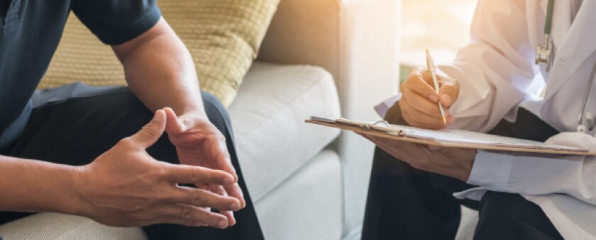 social worker taking notes in patient session