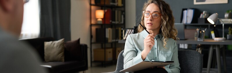 Female mental health counselor working with a patient