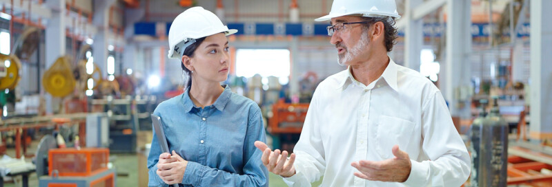 leader in engineering speaking to coworker