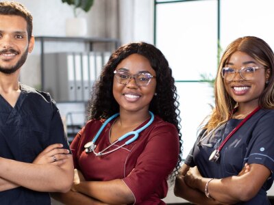Diverse multiethnic cheerful medical team at work in hospital.