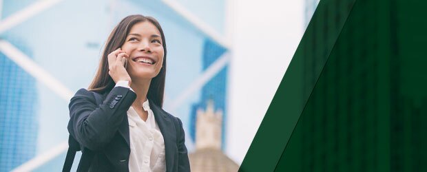 Smiling woman speaking on cell phone
