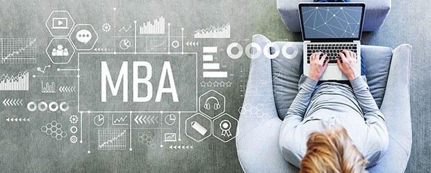 MBA with man using a laptop