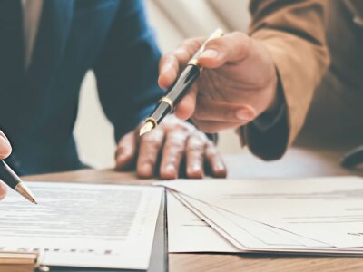 Judge gavel with health law lawyers having team meeting at law firm background.