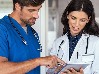 Doctor and nurse discussing a report