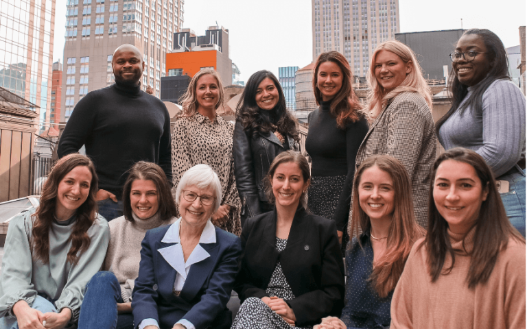 Group of Northwestern alumni outside in front of Chicago skyline