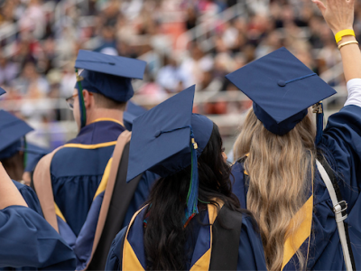 CSUMB graduates in regalia and Amazon, Chase, Deloitte, Google, and McKinsey and Company logos