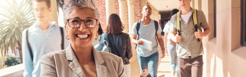 principal smiling in front of students