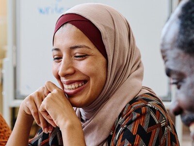 Divers group sitting at table in a community space
