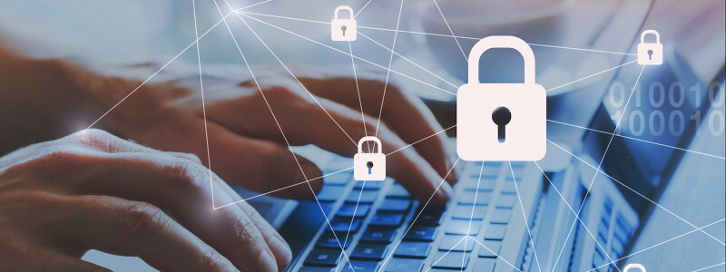 Hands type on a laptop, behind a graphic suggesting a chain of locked access points