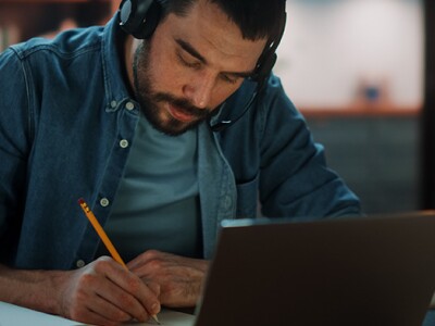 Man working on laptop at home