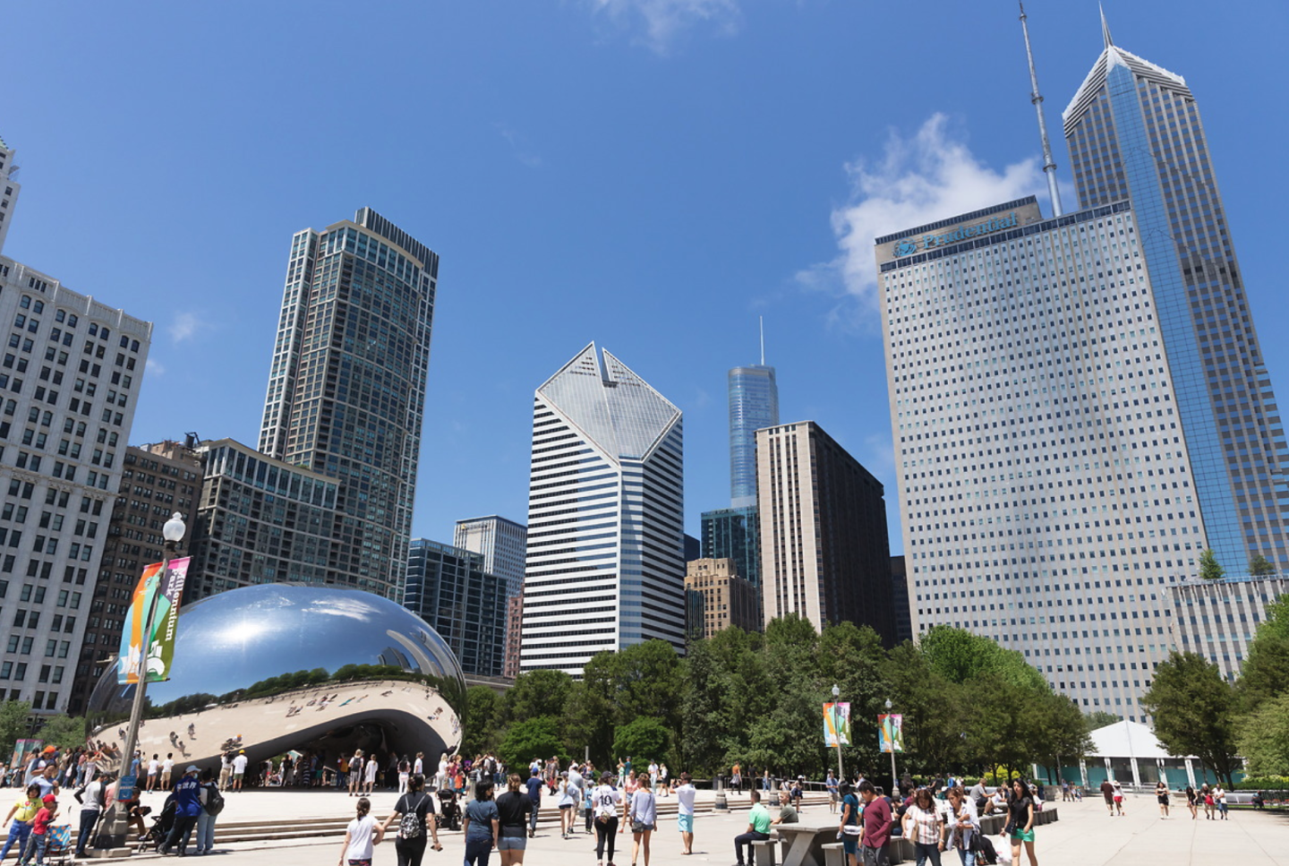 An angled view of the Chicago skyline with Cloud Gate statue