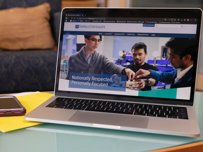 Laptop showing DePaul University website on screen