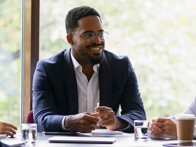 Group of school administrators and teachers meeting around a table