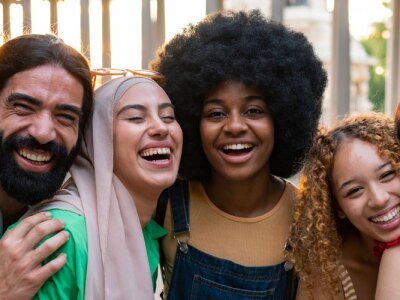Group of young multiracial friends traveling in the city.