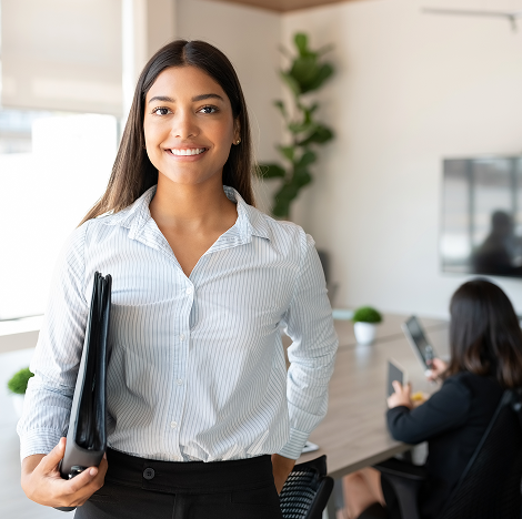 Professionally dressed woman smiling into the camera
