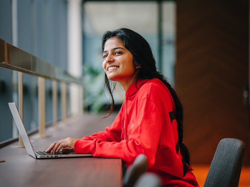 woman on laptop smiling
