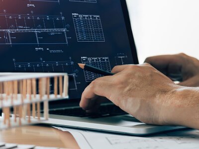 A man working on a laptop.