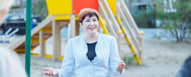 Elementary school principal speaks in front of playground