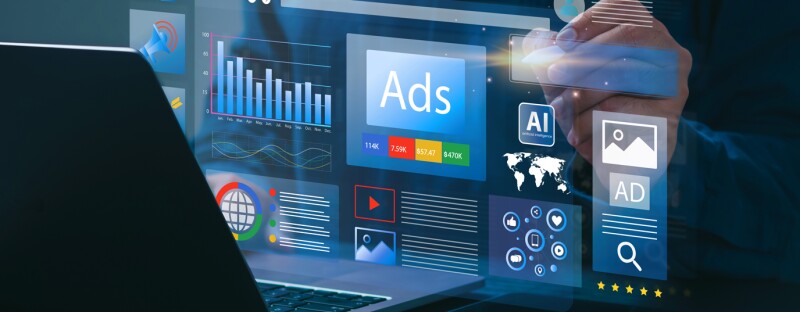 Hand using digital stylus on computer touchscreen