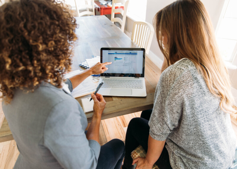 financial advisor reviewing portfolio with client