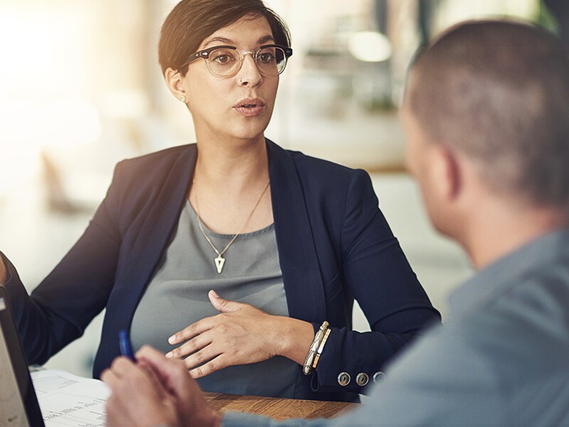 Business analysts reviewing interactive dashboard
