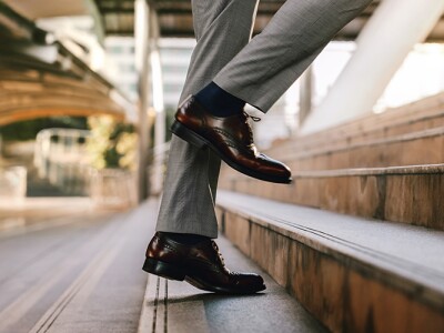 Businessman walking up steps outside in the city