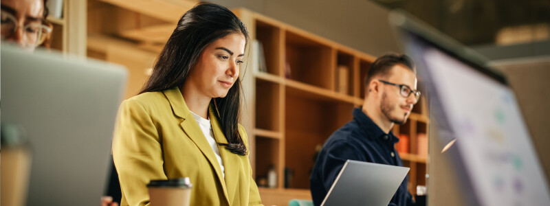 Young female professional working full-time while earning her MBA online.