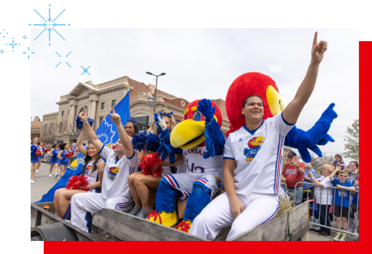 Members of the women's softball team cheer in a parade after a title game.