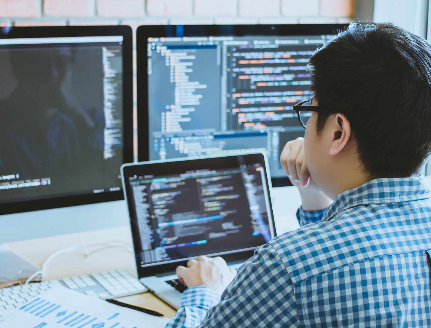 Man programming on a laptop