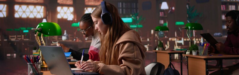 College students sitting at their desk in a classroom participating in an online webinar course about law