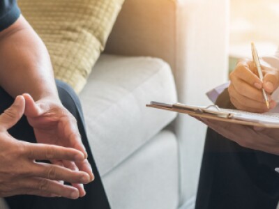 social worker taking notes in patient session