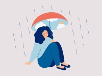 A woman protects herself from the rain with an umbrella