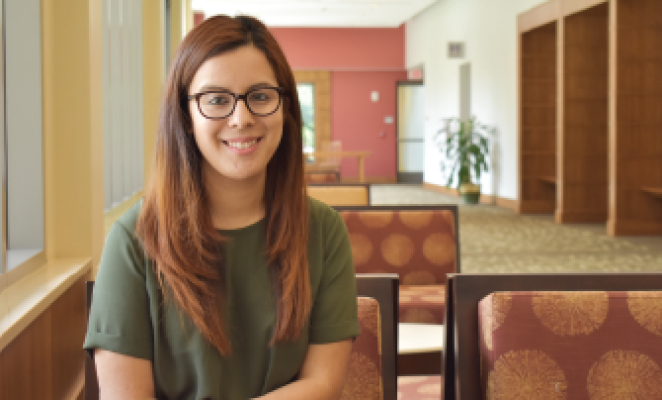 Smiling young woman with glasses