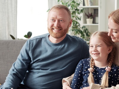 Couple and child sitting in a family therapy sessions