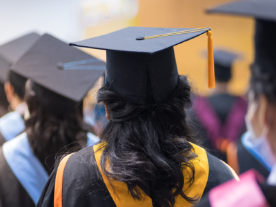 graduates walking to collect diploma