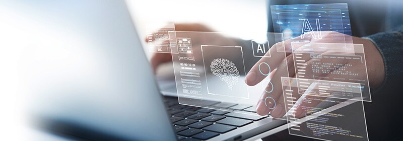 Person at keyboard using AI tools for business