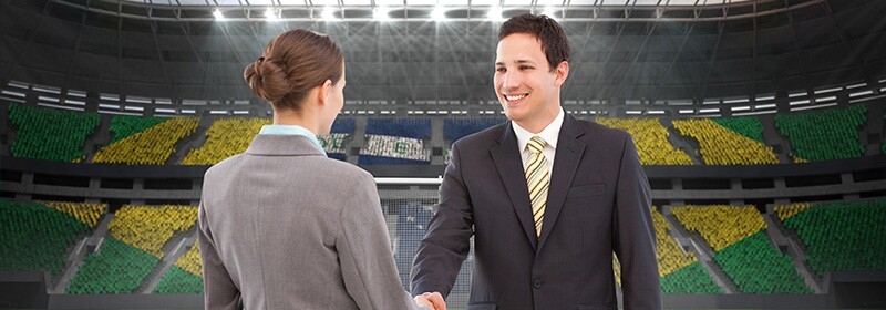 two executives in a sports arena