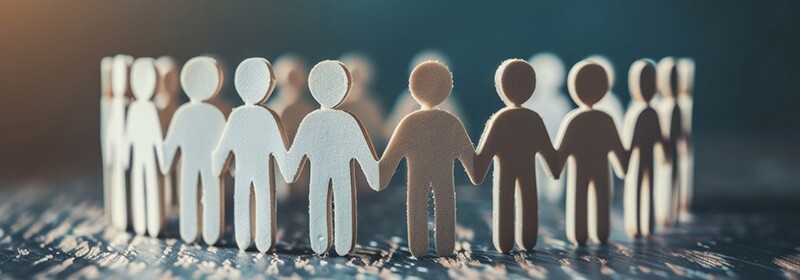 A group of figures holding hands