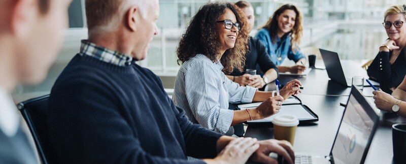 Public health professionals meeting in light-filled office