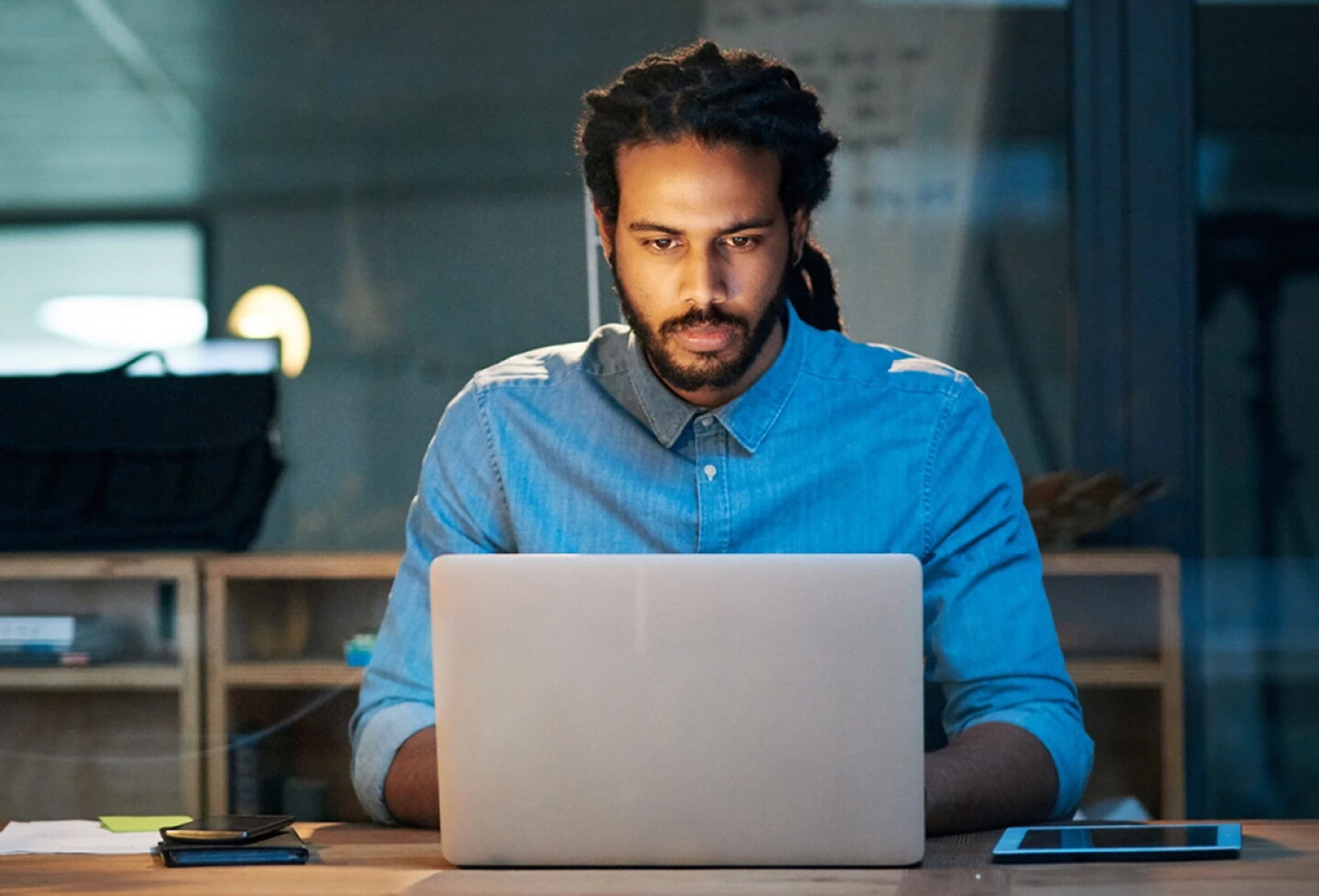 Man working on a laptop.